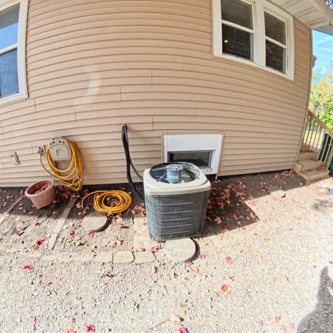 a house with trees in the background