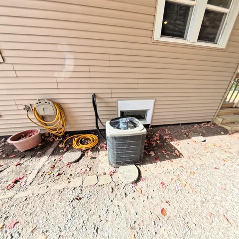 a view of a patio with chair and potted plants