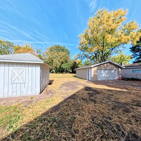 a view of a house with wooden fence