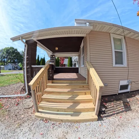 a view of a house with a floor to ceiling windows