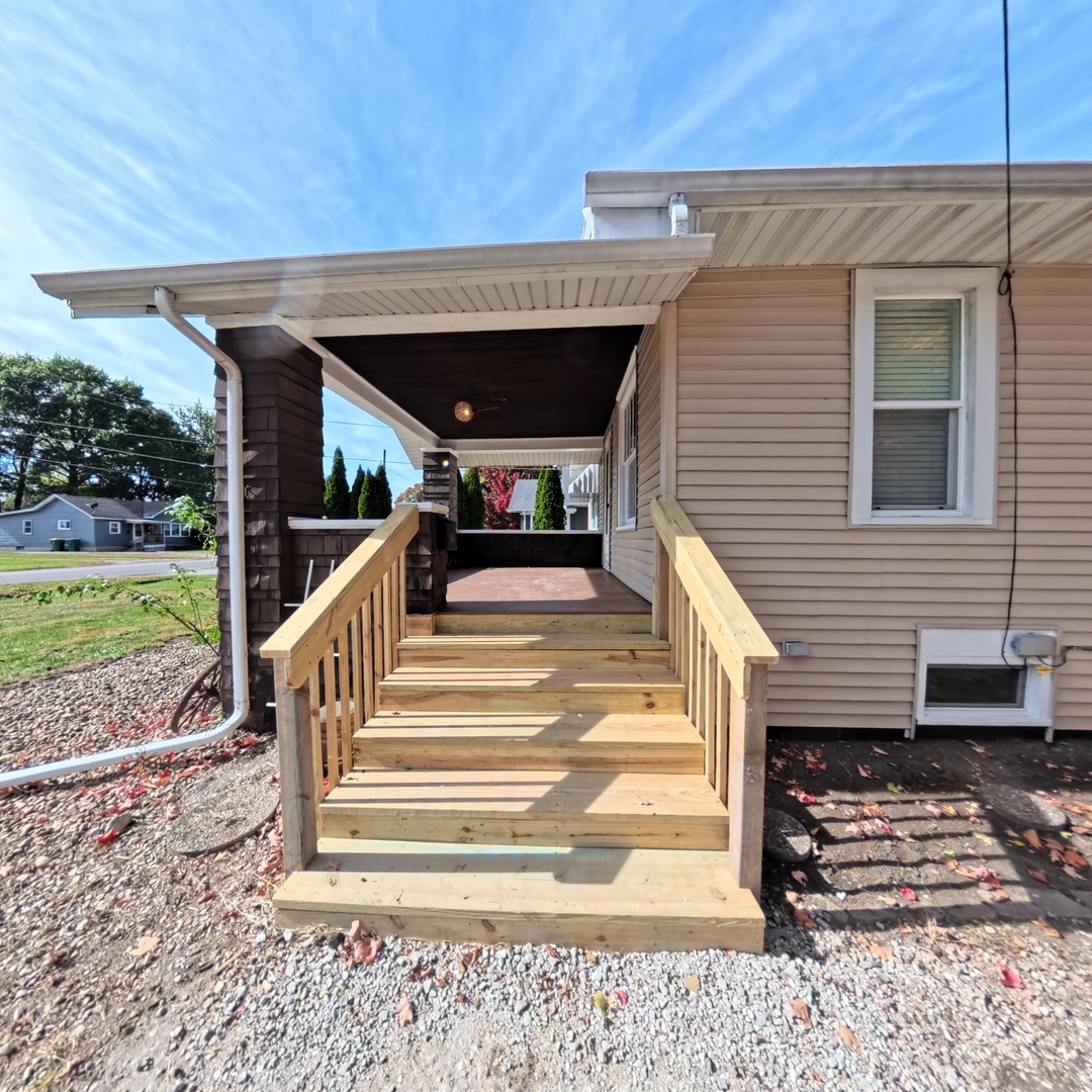 118 West 3rd Street Streator, IL 61364 - Photo 4 of 29 a view of a patio with table and chairs near a yard