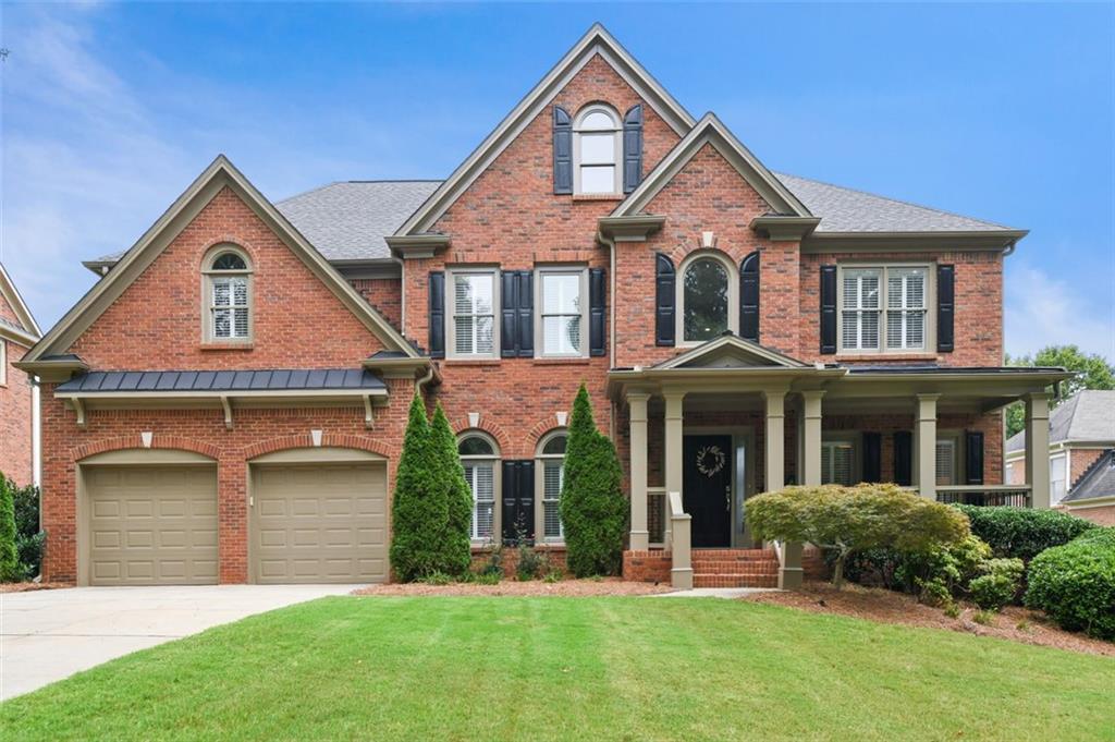 8835 Appling Ridge Cumming, GA 30041 - Photo 1 of 1 front view of a house with a yard