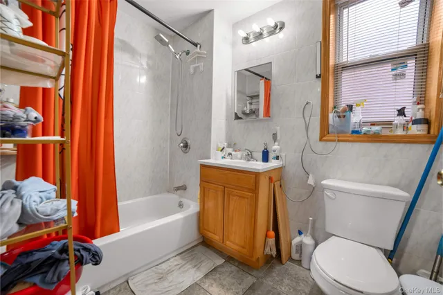 a bathroom with a toilet bathtub and sink