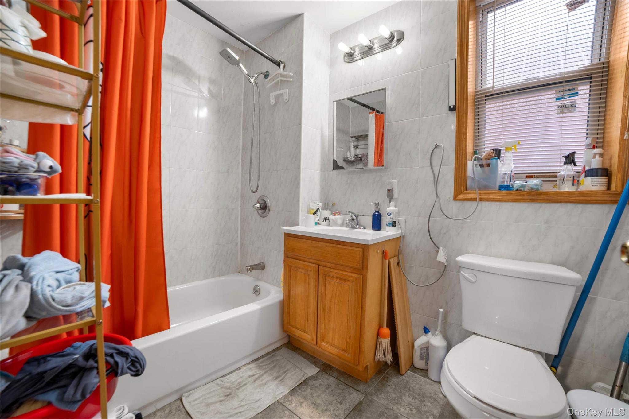 58-04 Main Street, Unit 1A Queens, NY 11355 - Photo 13 of 21 a bathroom with a toilet bathtub and sink