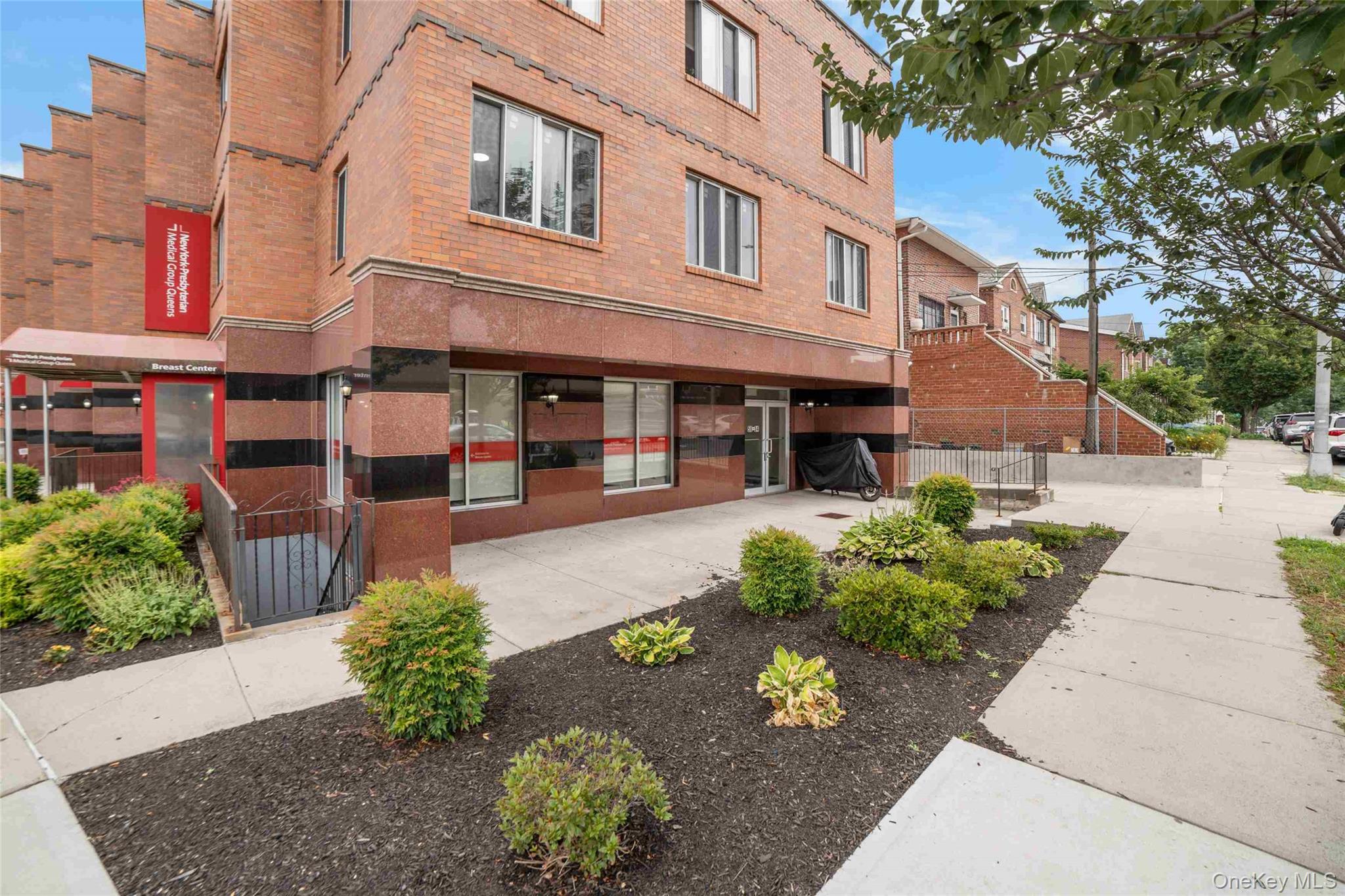 58-04 Main Street, Unit 1A Queens, NY 11355 - Photo 4 of 21 a view of a building with a garden