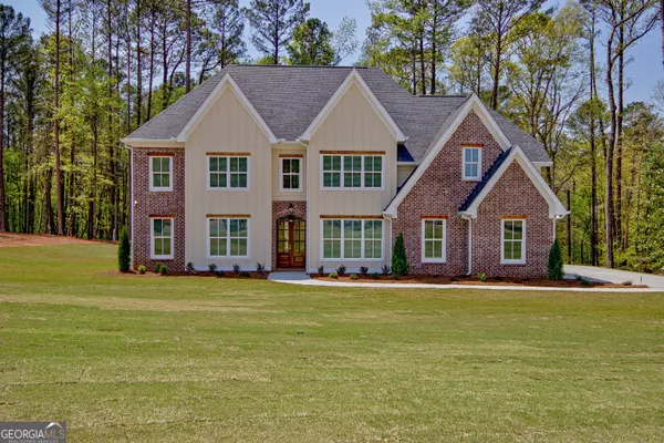 a front view of a house with a yard