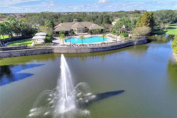 a view of a swimming pool with a yard