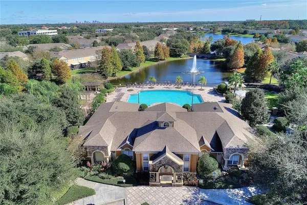 an aerial view of a house with a lake view