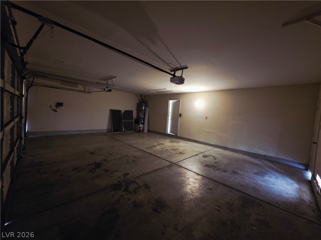 2920 Setting Sun Street Las Vegas, NV 89117 - Photo 38 of 43 This spacious garage offers ample room for vehicles and storage, featuring a durable concrete floor.