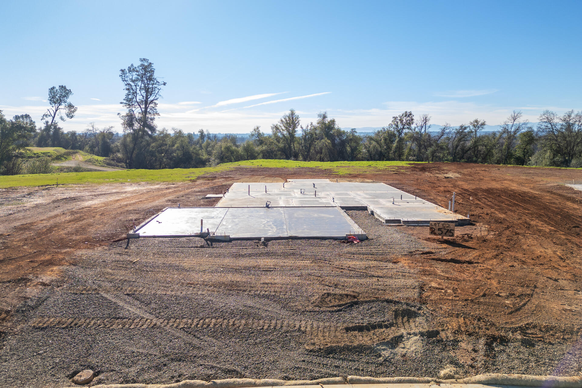 a view of a swimming pool and trees in the background