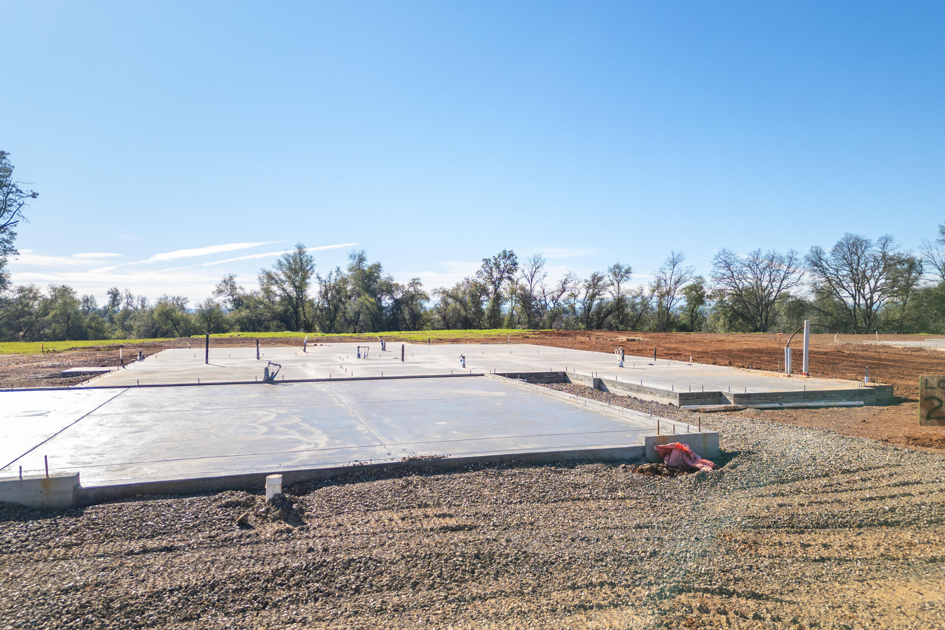 2575 Uphill Avenue Redding, CA 96002 - Photo 4 of 5 a view of a lake with a yard and large trees