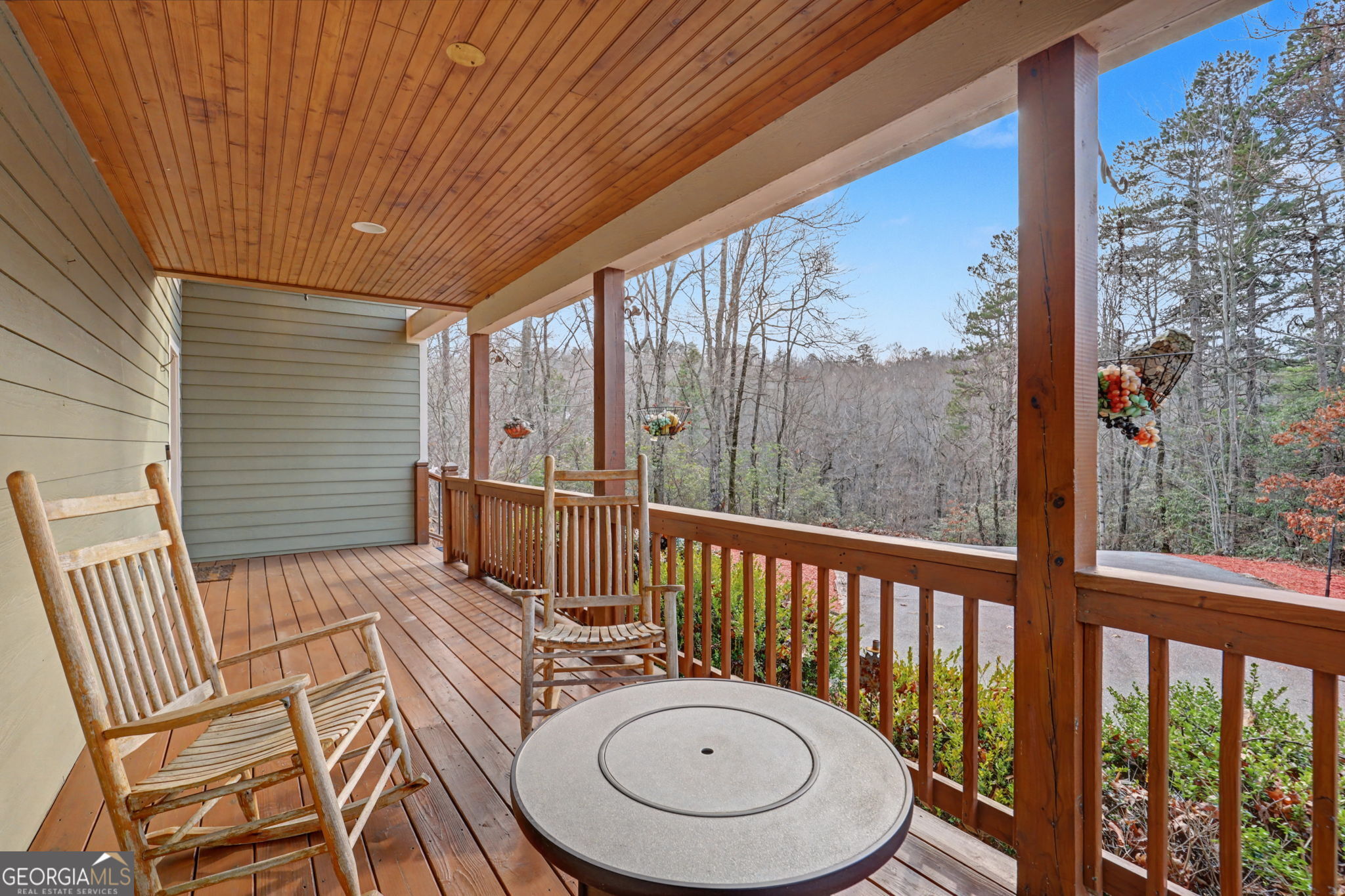 1176 Tiger Pass Drive Tiger, GA 30576 - Photo 15 of 67 a view of balcony with a table and chairs