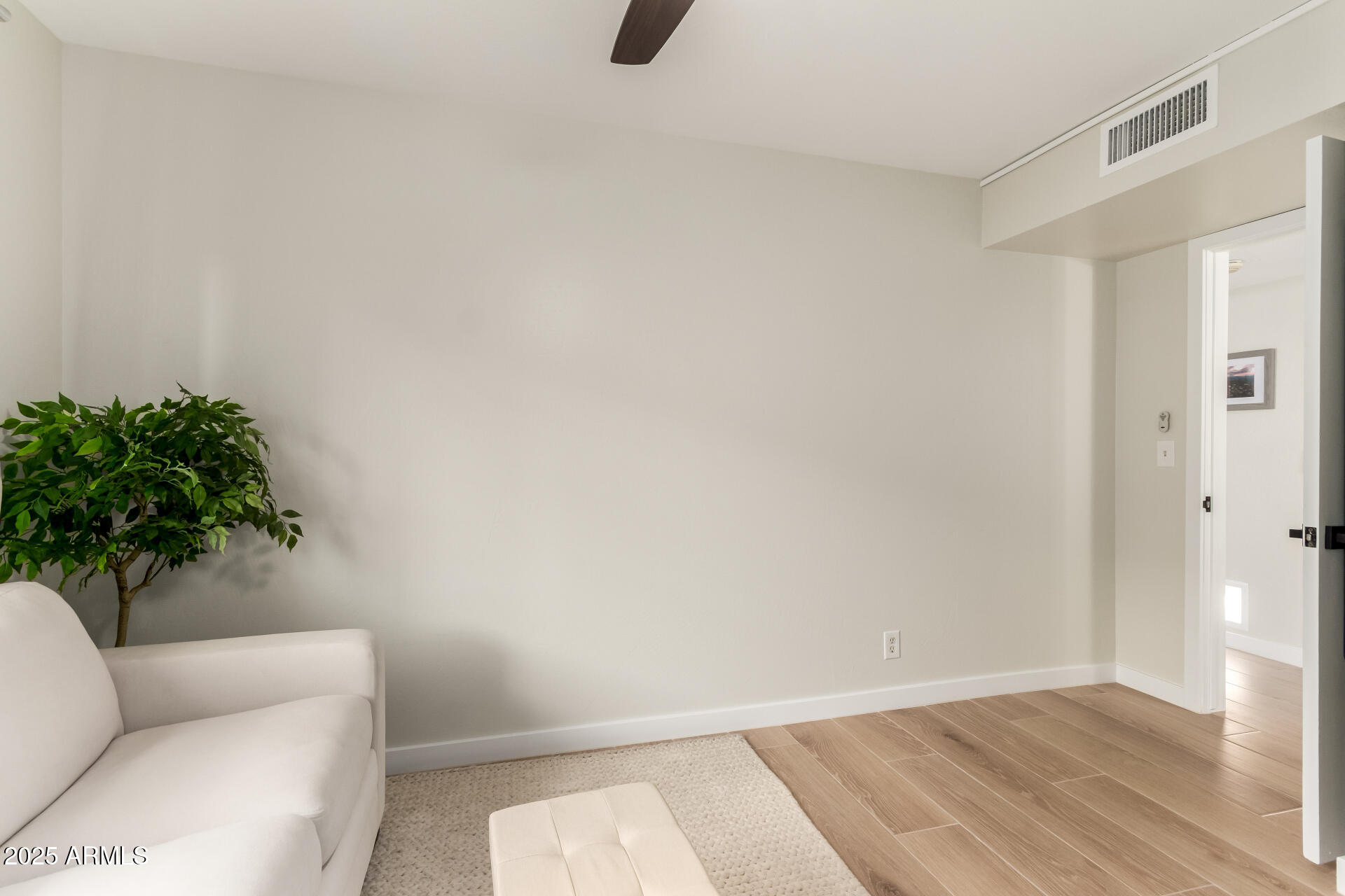 1207 East Northshore Drive, Unit 136 Tempe, AZ 85283 - Photo 14 of 49 a living room with furniture and a potted plant