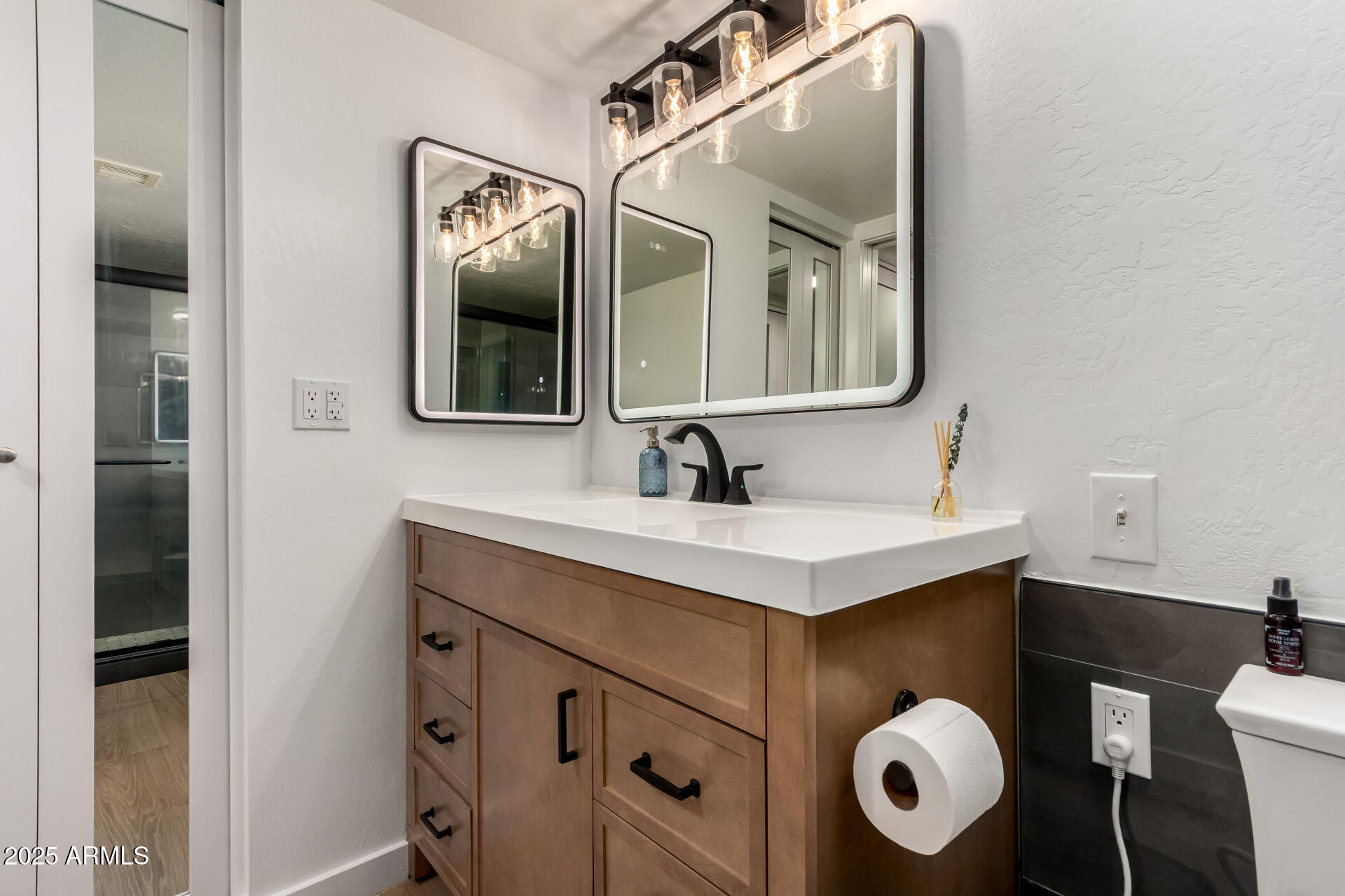 1207 East Northshore Drive, Unit 136 Tempe, AZ 85283 - Photo 20 of 49 a bathroom with a sink mirror and vanity