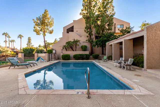 a view of a swimming pool with a patio