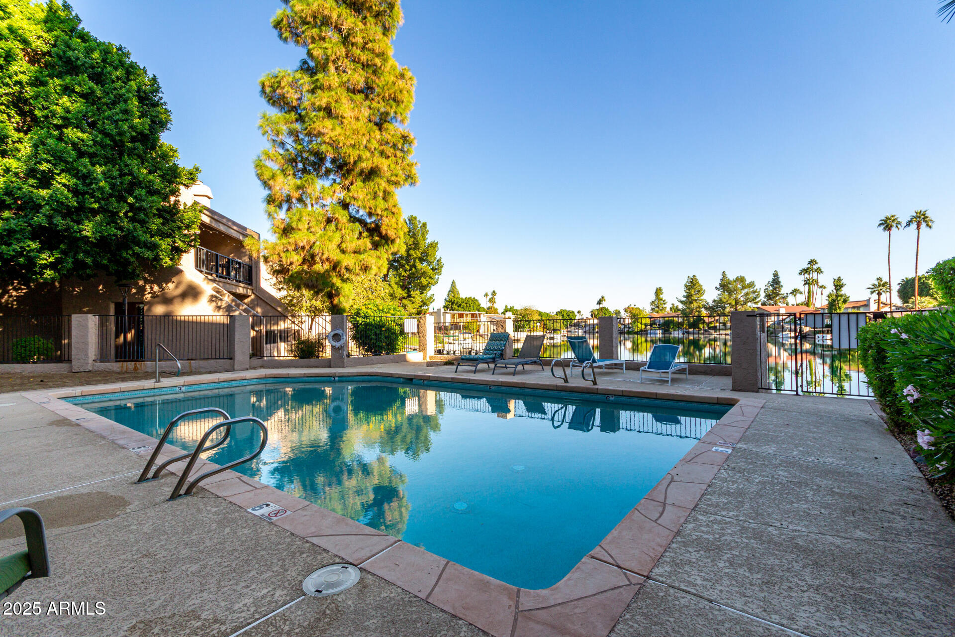 1207 East Northshore Drive, Unit 136 Tempe, AZ 85283 - Photo 32 of 49 a view of a lake with a patio