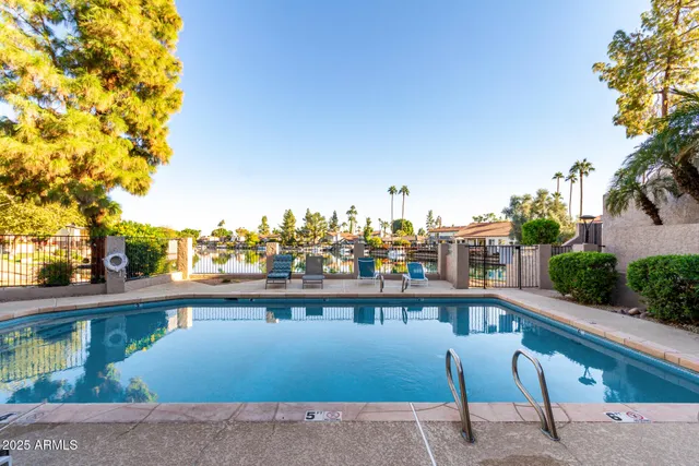 a view of a golf course with a tree