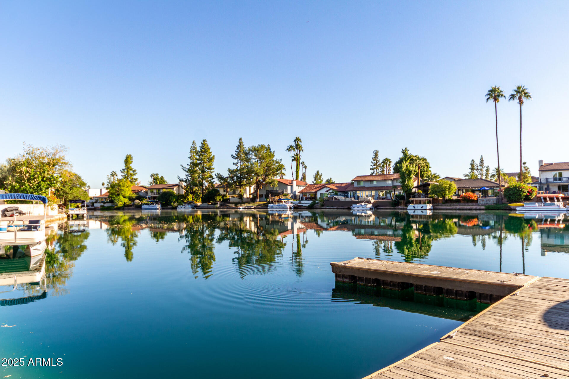 1207 East Northshore Drive, Unit 136 Tempe, AZ 85283 - Photo 35 of 49 a view of a lake with boats and trees