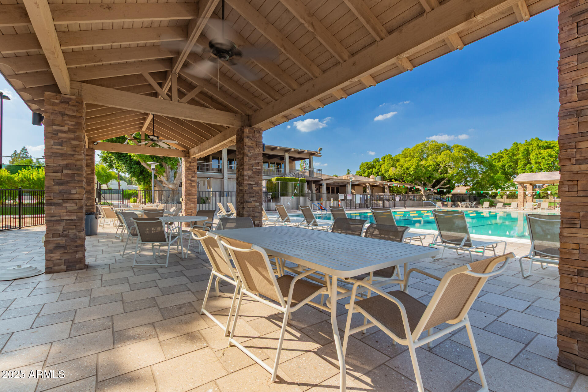 1207 East Northshore Drive, Unit 136 Tempe, AZ 85283 - Photo 37 of 49 a patio with a table and chairs