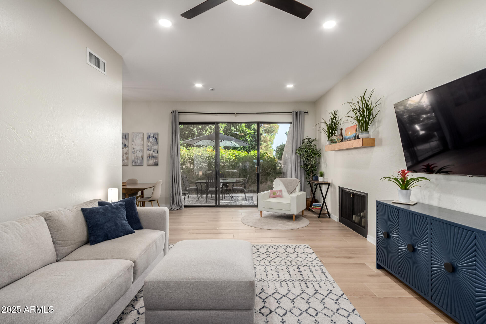 1207 East Northshore Drive, Unit 136 Tempe, AZ 85283 - Photo 4 of 49 a living room with furniture and a flat screen tv