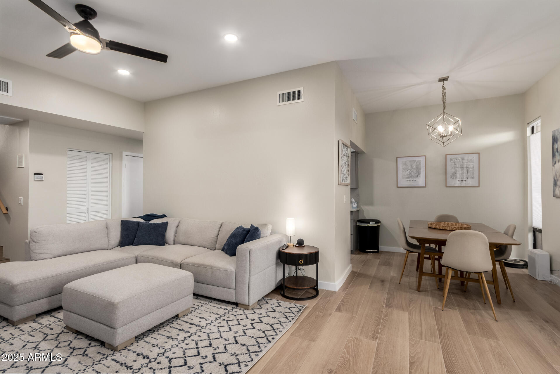 1207 East Northshore Drive, Unit 136 Tempe, AZ 85283 - Photo 7 of 49 a living room with furniture and a chandelier