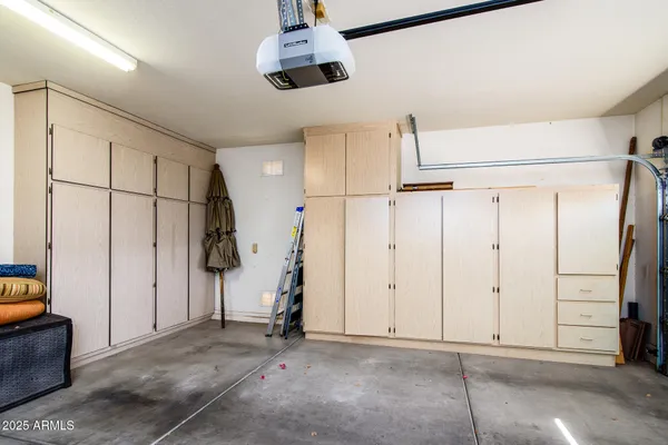 a roof deck with table and chairs couches and wooden floor