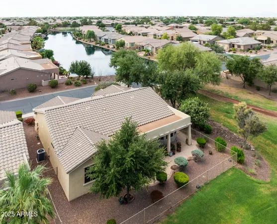 an aerial view of a house with garden space and street view