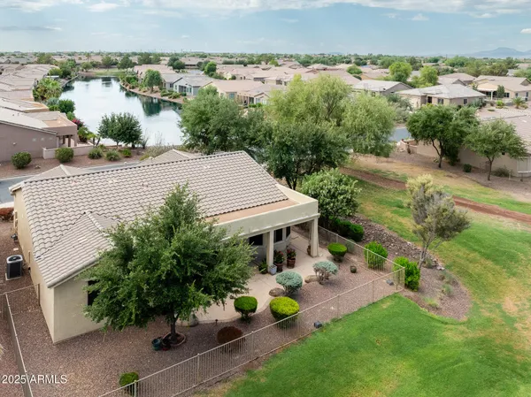 an aerial view of a house with garden space and street view