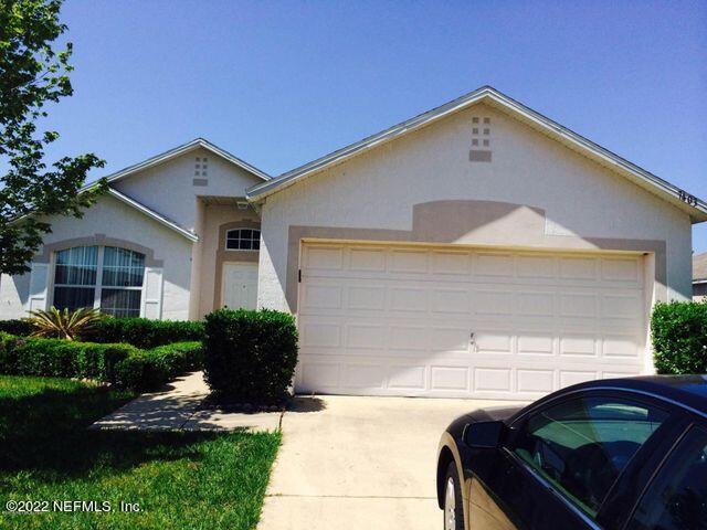 7403 High Bluff Road North Jacksonville, FL 32244 - Photo 1 of 9 a front view of a house with garden