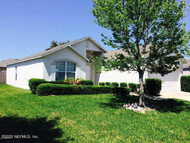 7403 High Bluff Road North Jacksonville, FL 32244 - Photo 2 of 9 a front view of a house with a yard