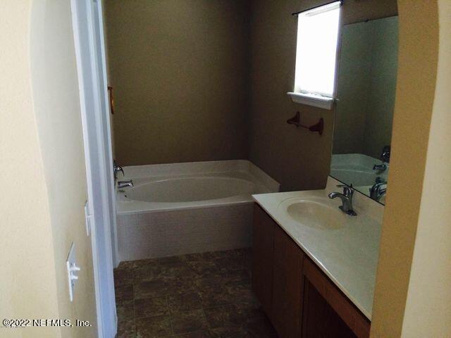 7403 High Bluff Road North Jacksonville, FL 32244 - Photo 9 of 9 a bathroom with a sink and a bathtub