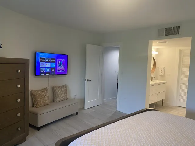 a bedroom with a bed and a couch