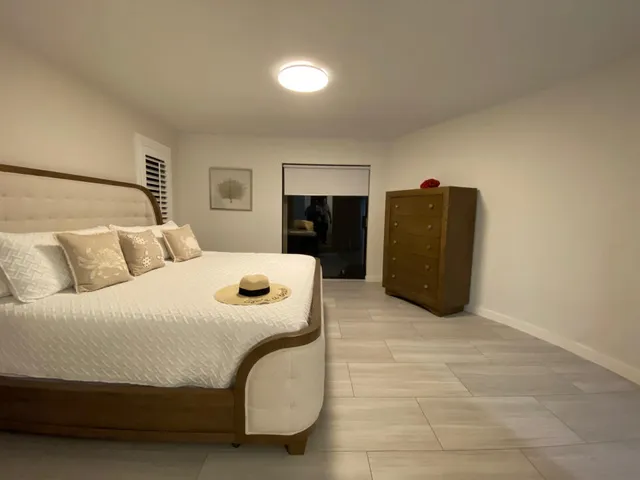 a bedroom with a bed and a cabinets