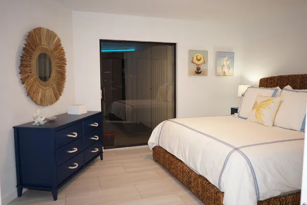 a bedroom with a bed and a dresser