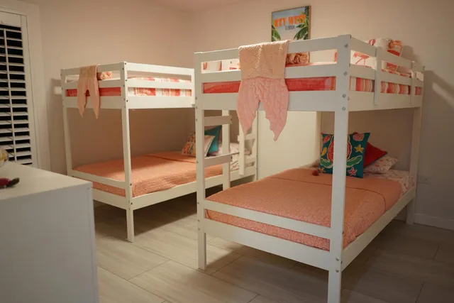 a view of a bedroom with baby bed