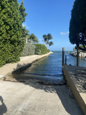 a view of a water fountain and in front of the house
