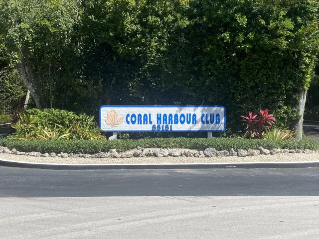 a bathroom with a toilet and a window