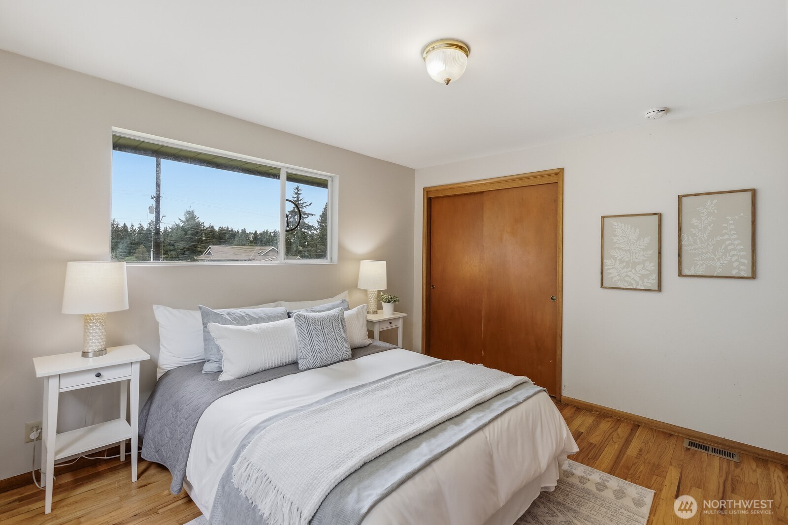 3822 Shelby Road Lynnwood, WA 98087 - Photo 22 of 40 a bedroom with a bed and a painting on the wall