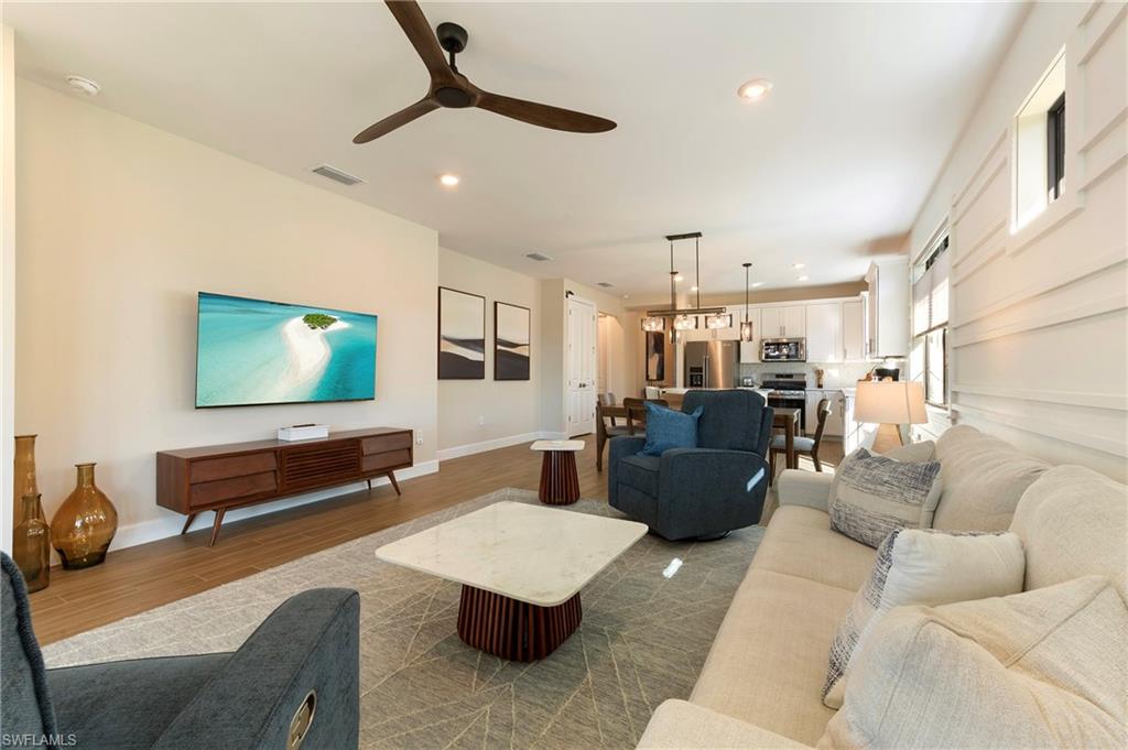 11929 Sacra Place Fort Myers, FL 33913 - Photo 14 of 50 a living room with furniture and a flat screen tv