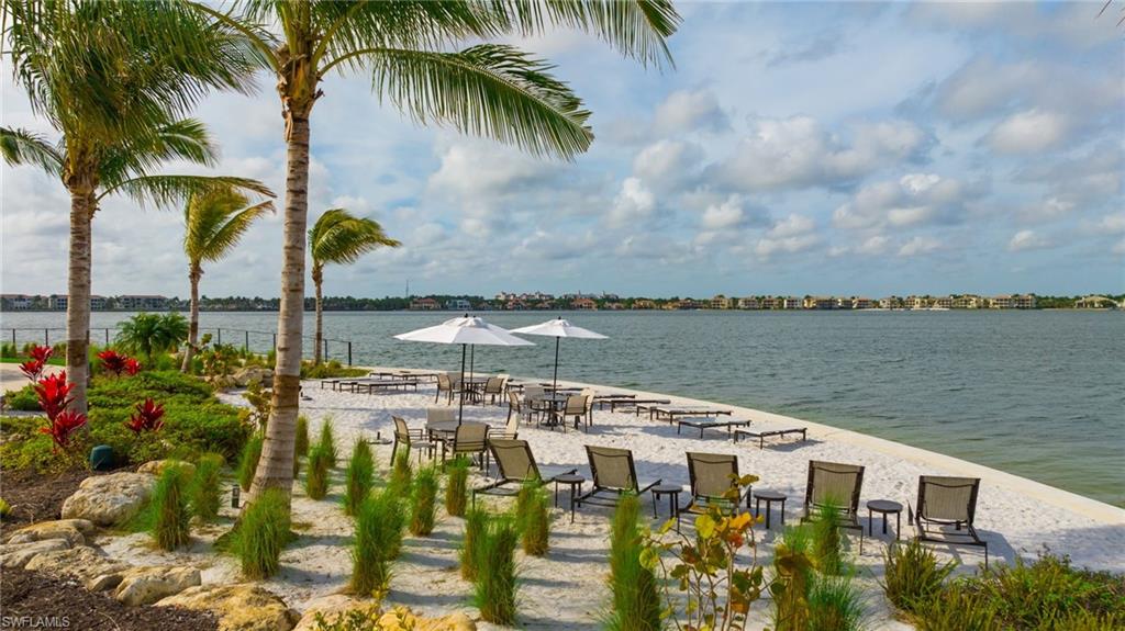 11929 Sacra Place Fort Myers, FL 33913 - Photo 34 of 50 a view of a lake with a building in the background