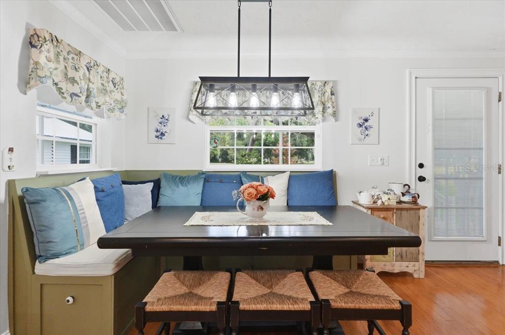 2910 Fritzke Road Dover, FL 33527 - Photo 50 of 100 a view of a dining room with furniture window and wooden floor