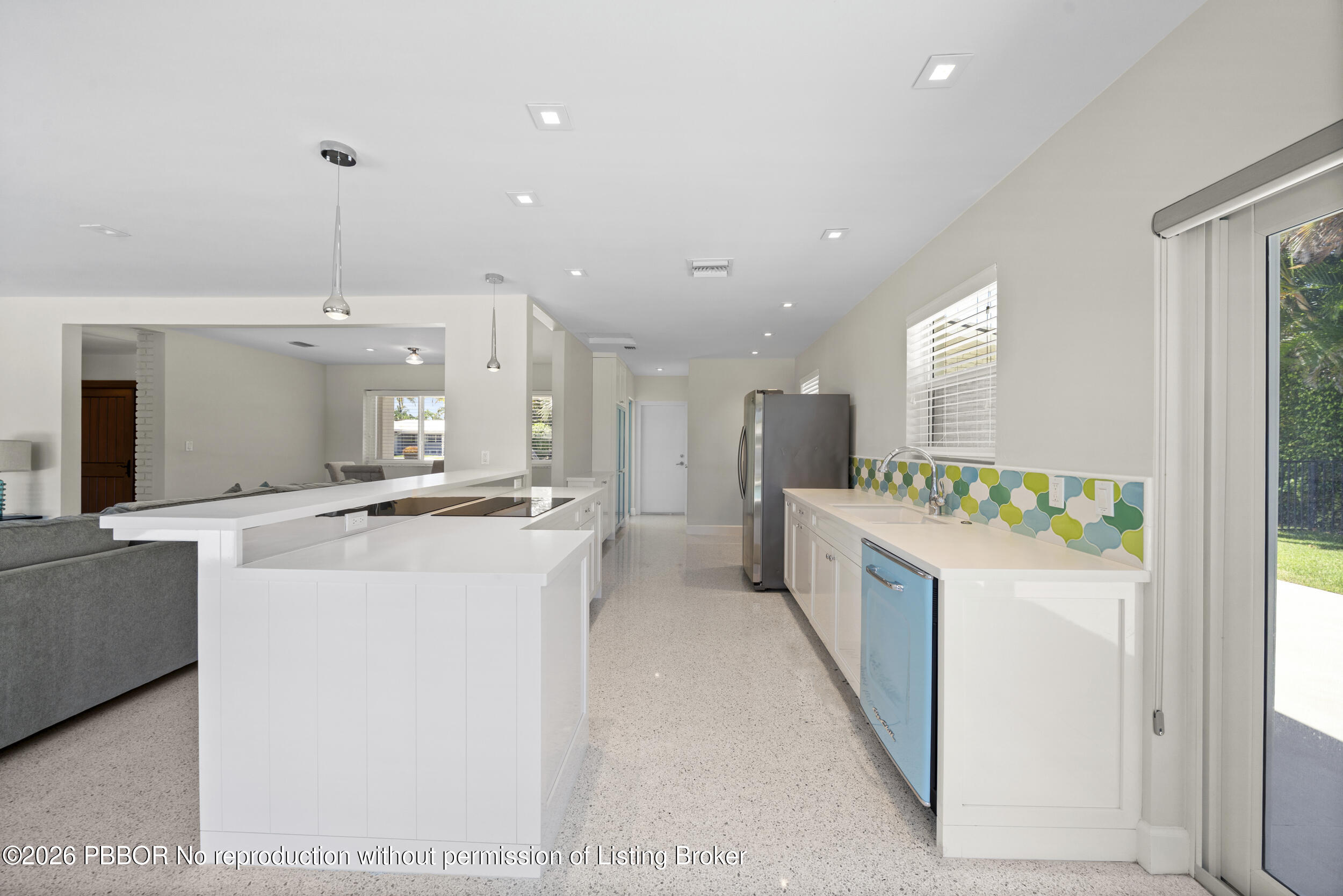 2259 Ibis Isle Road East, Unit E Palm Beach, FL 33480 - Photo 7 of 28 a kitchen with kitchen island sink stove and refrigerator