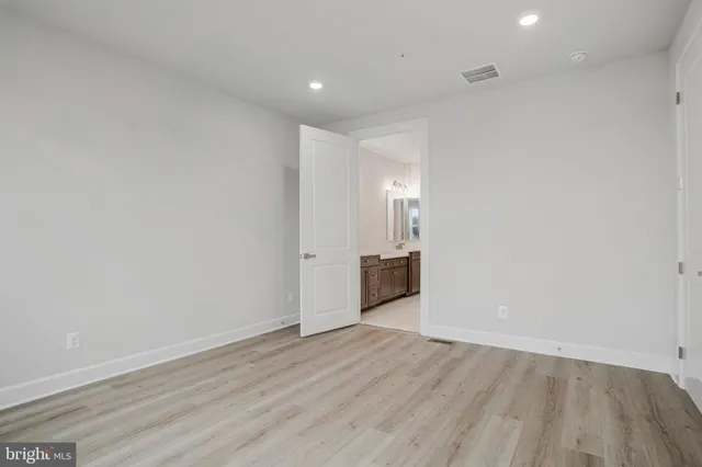 a bathroom with a sink vanity and mirror