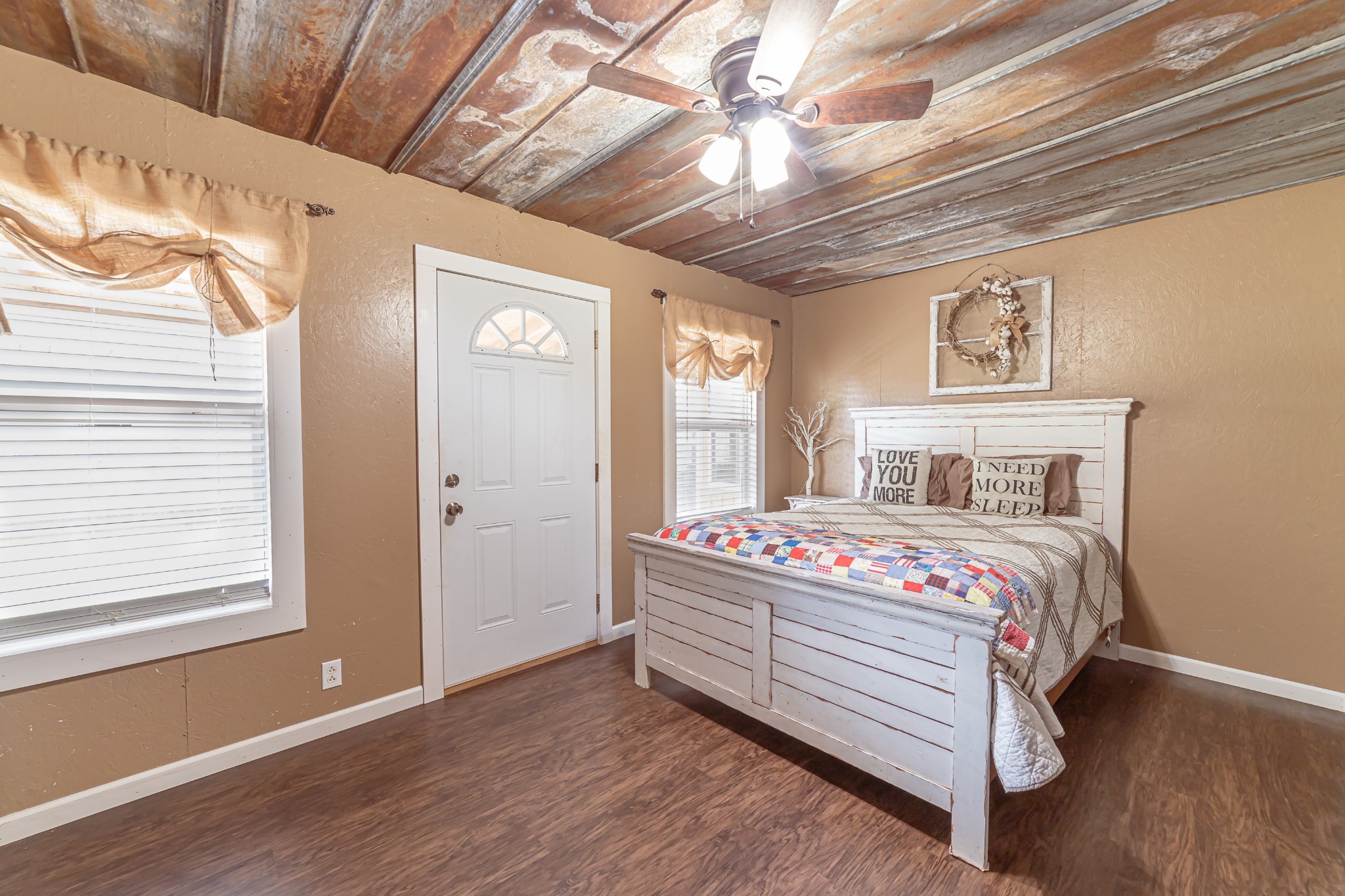 715 Mcgowen Road Morrison, TN 37357 - Photo 14 of 50 a bedroom with a bed and wooden floor