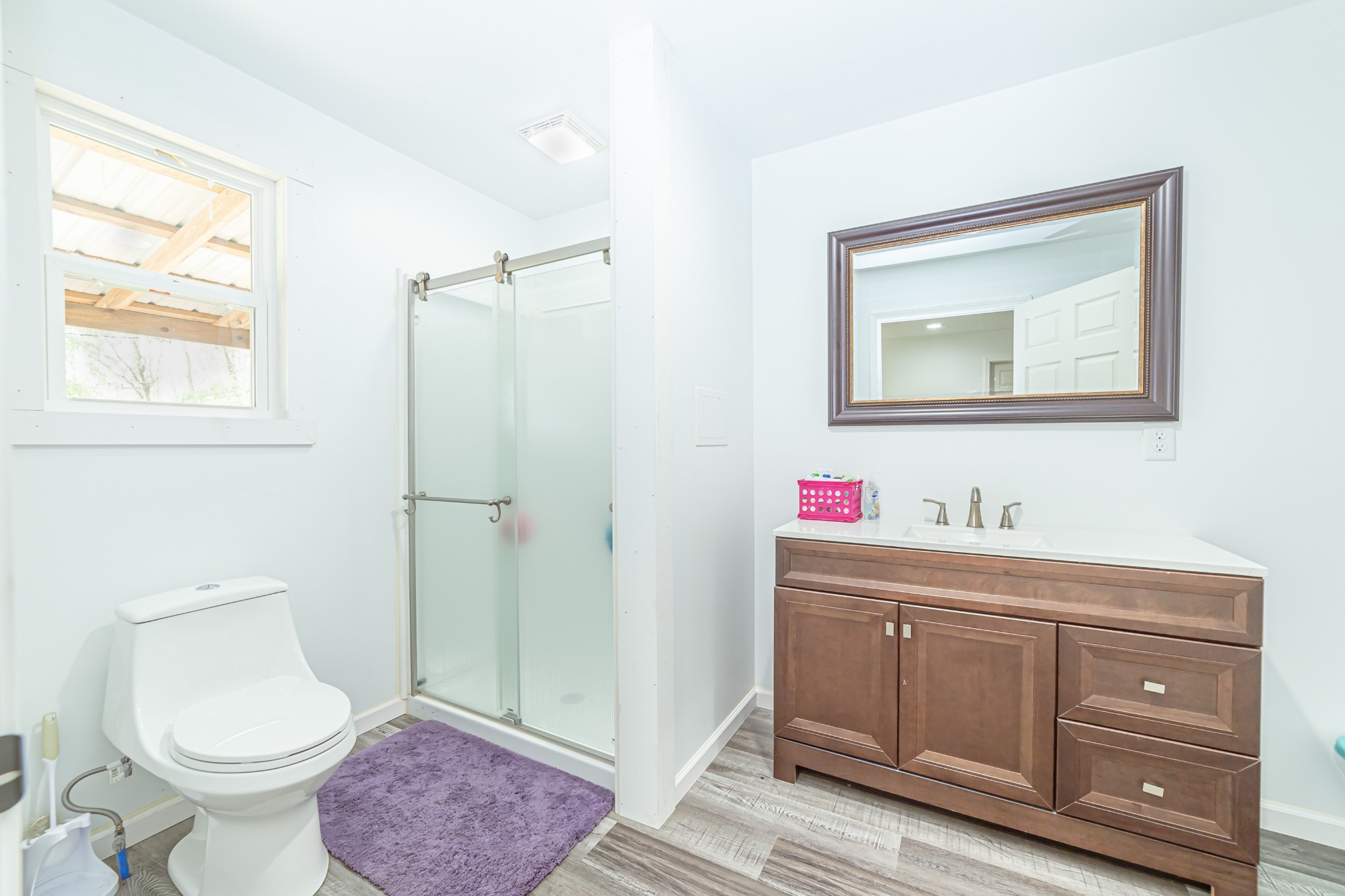 715 Mcgowen Road Morrison, TN 37357 - Photo 26 of 50 a bathroom with a toilet a sink and a mirror