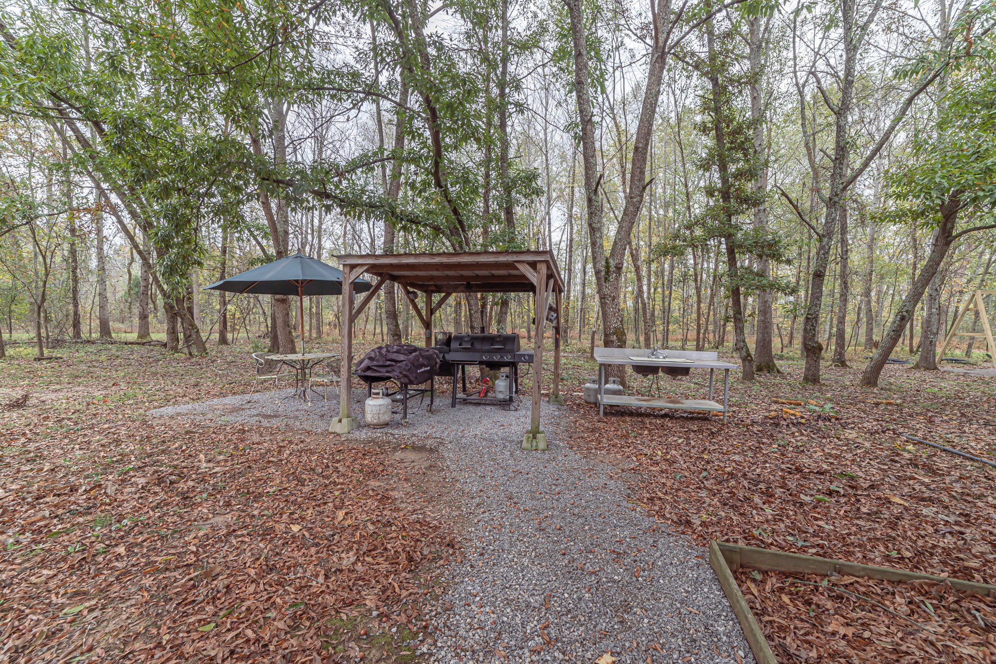 715 Mcgowen Road Morrison, TN 37357 - Photo 43 of 50 a view of a house with backyard and sitting area