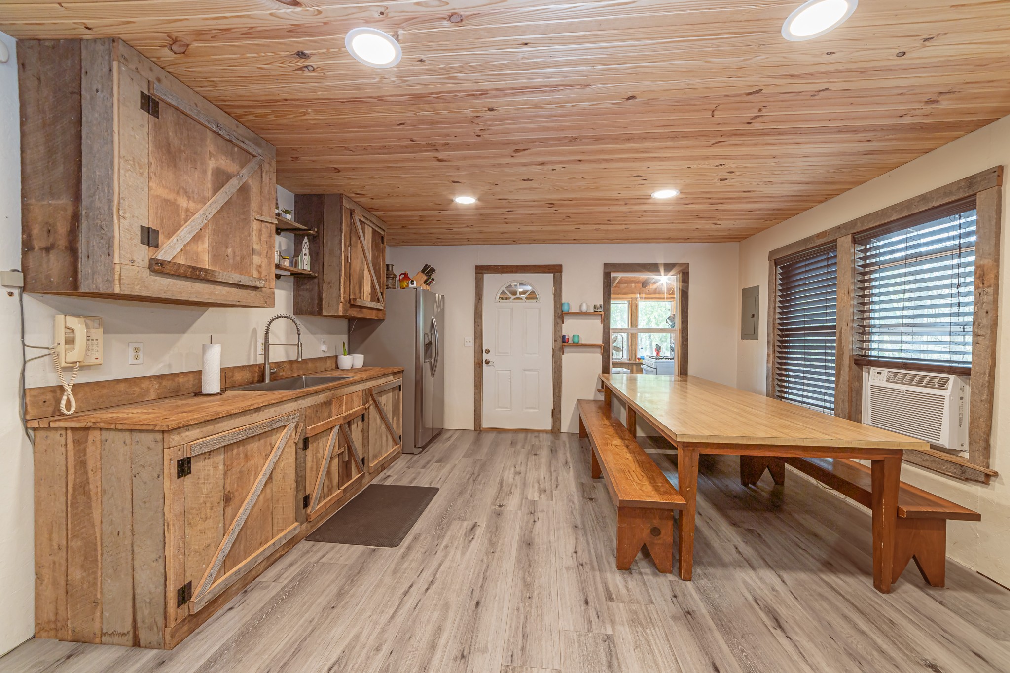 715 Mcgowen Road Morrison, TN 37357 - Photo 8 of 50 a kitchen with sink cabinets and wooden floor
