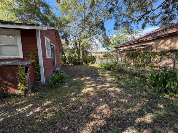 a view of a house with a tree