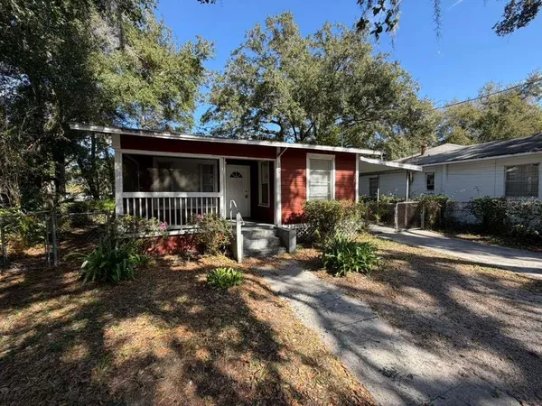a view of house with patio outdoor seating and yard