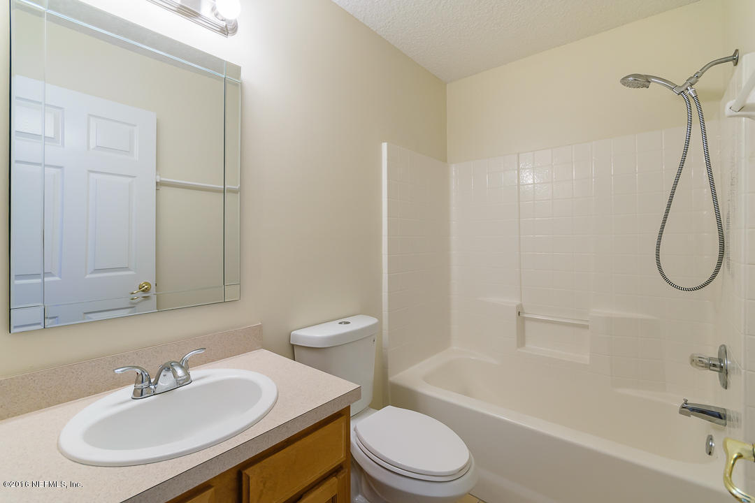 4329 Rye Court St. Johns, FL 32259 - Photo 17 of 25 a bathroom with a sink toilet and shower